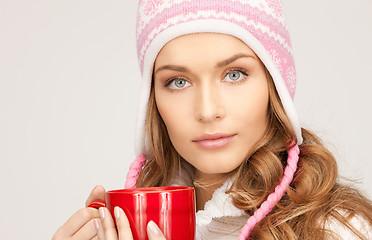 Image showing beautiful woman with red mug