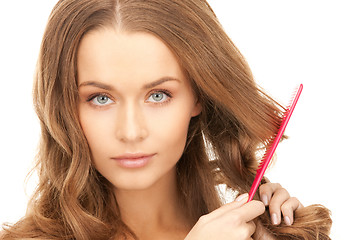 Image showing beautiful woman with comb