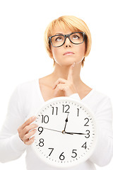 Image showing woman holding big clock