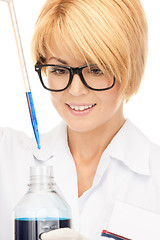 Image showing lab worker holding up test tube