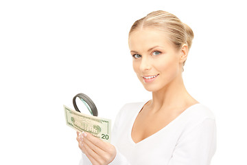 Image showing woman with magnifying glass and money