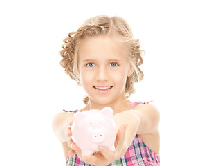 Image showing little girl with piggy bank