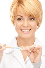 Image showing attractive female doctor with thermometer