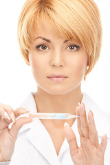 Image showing attractive female doctor with thermometer