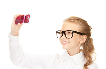 Image showing happy girl taking picture with cell phone