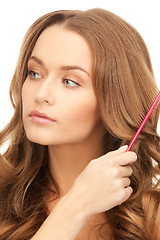 Image showing beautiful woman with comb