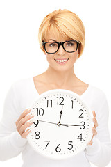 Image showing woman holding big clock