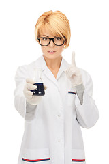 Image showing lab worker holding up test tube