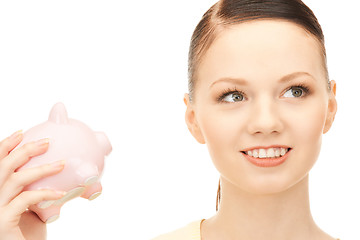 Image showing  lovely woman with piggy bank	 