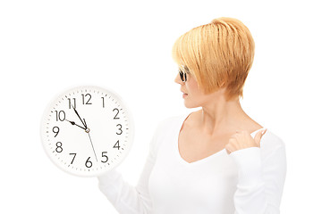 Image showing woman holding big clock