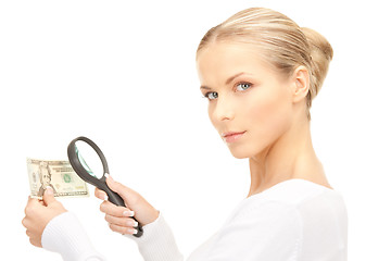 Image showing woman with magnifying glass and money