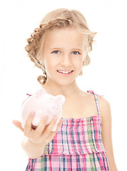 Image showing little girl with piggy bank