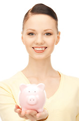 Image showing  lovely woman with piggy bank	 