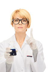 Image showing lab worker holding up test tube