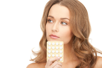 Image showing young beautiful woman with pills 