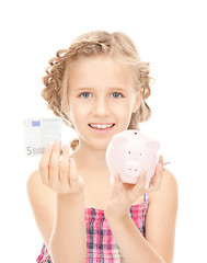 Image showing little girl with piggy bank and money