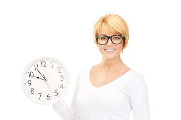 Image showing woman holding big clock