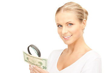 Image showing woman with magnifying glass and money