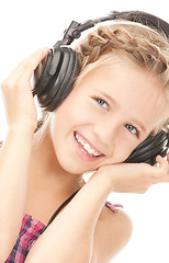 Image showing happy girl in big headphones