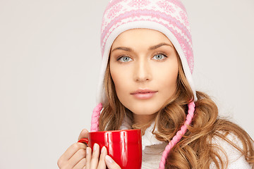 Image showing beautiful woman with red mug