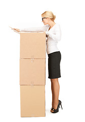 Image showing  attractive businesswoman with big boxes	 