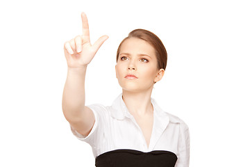 Image showing businesswoman working with something imaginary