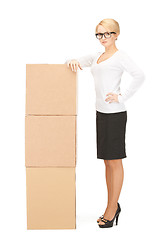 Image showing  attractive businesswoman with big boxes	 