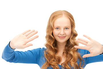 Image showing businesswoman working with something imaginary