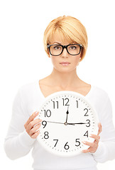 Image showing woman holding big clock