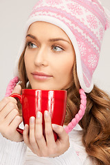 Image showing beautiful woman with red mug