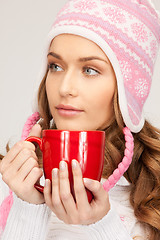 Image showing beautiful woman with red mug