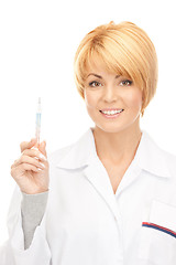 Image showing attractive female doctor with thermometer