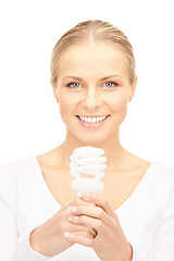 Image showing woman holding energy saving bulb