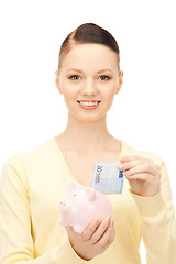 Image showing lovely woman with piggy bank 