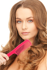 Image showing beautiful woman with comb