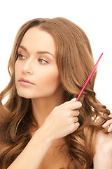 Image showing beautiful woman with comb