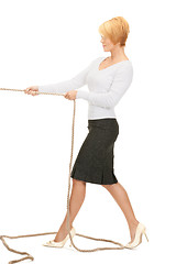 Image showing business woman pulling rope