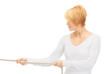 Image showing business woman pulling rope