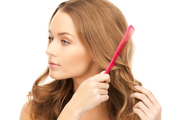 Image showing beautiful woman with comb