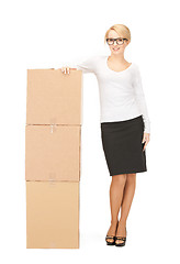 Image showing  attractive businesswoman with big boxes	 