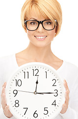 Image showing woman holding big clock