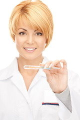 Image showing attractive female doctor with thermometer