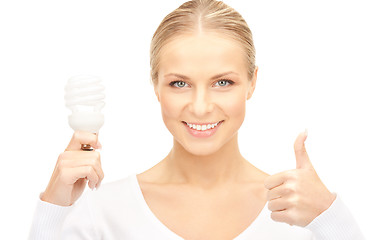 Image showing woman holding energy saving bulb