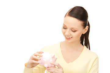 Image showing  lovely woman with piggy bank	 