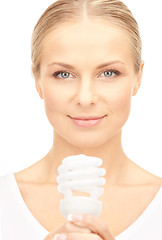 Image showing woman holding energy saving bulb