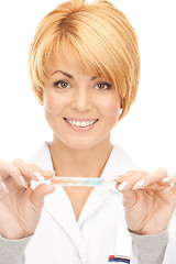 Image showing attractive female doctor with thermometer