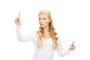 Image showing businesswoman working with something imaginary