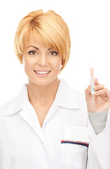 Image showing attractive female doctor with thermometer