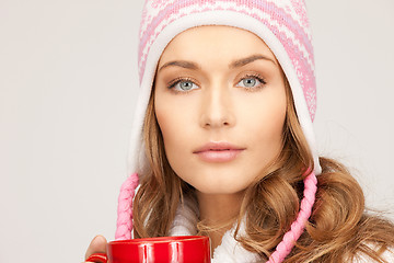 Image showing beautiful woman with red mug