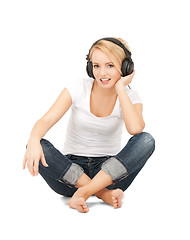Image showing  happy teenage girl in big headphones